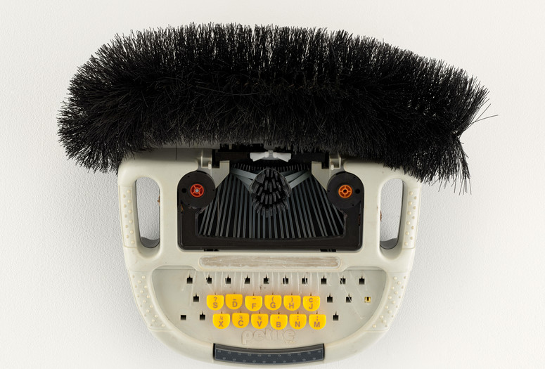Romuald Hazoumè. Petite. 1999. Typewriter, metal and brush, 14 3/16 × 15 3/4 × 6 5/16" (36 × 40 × 16 cm). CAAC-The Pigozzi Collection. Gift of Jean Pigozzi. Photo: Robert Gerhardt