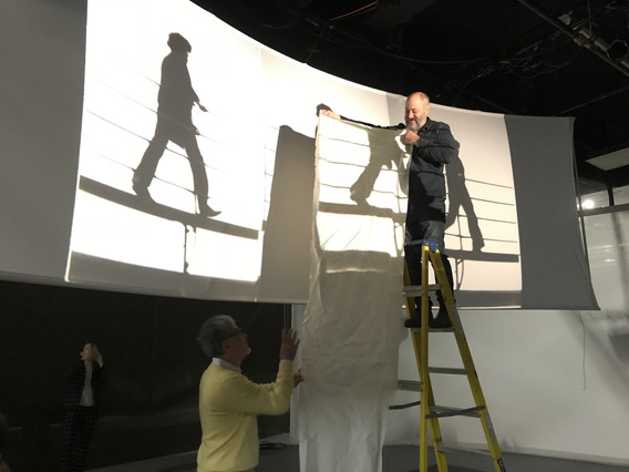 Paul DiPietro and Gulliver looking at various screen materials for projection, October 2018