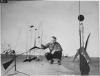Publicity photograph of Alexander Calder during the installation of Alexander Calder, September 29, 1943–January 16, 1944. 1943. Gelatin silver print, 3 3/4 × 4 3/4″ (9.5 × 12 cm). Photographic Archive, The Museum of Modern Art Archives, New York. © 2021 Calder Foundation, New York/Artists Rights Society (ARS), New York