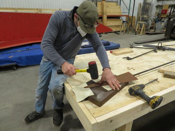 Reshaping an element of the sculpture at Monumenta Art Conservation. Photo: Abigail Mack