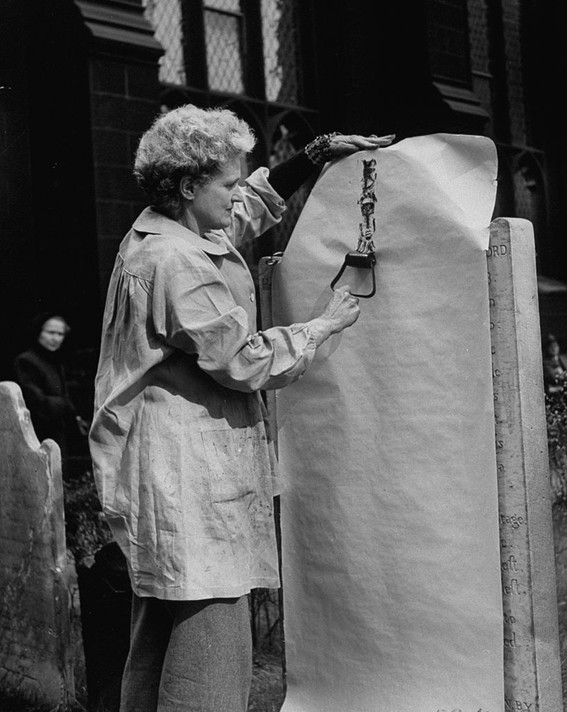 From Life magazine, October 1, 1954: “Tombstone artist Sari Dienes, in grave-yard tracing old tombstone impressions to create her unusual form of art”
