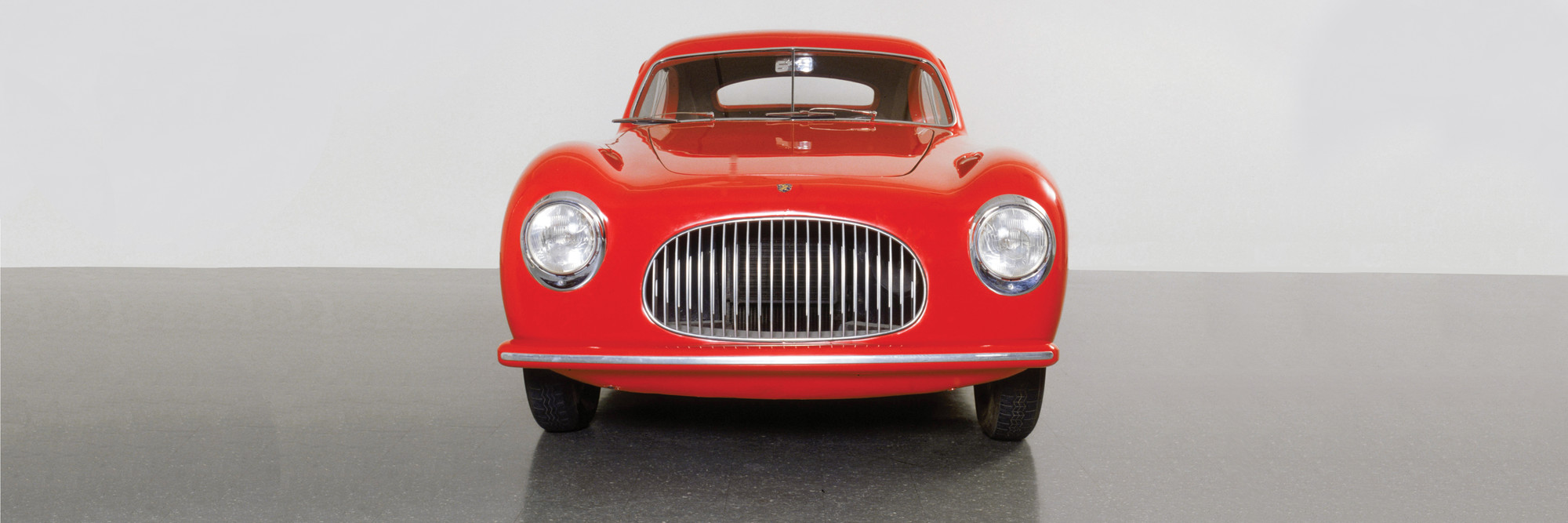Pininfarina (Battista “Pinin” Farina). Cisitalia 202 GT Car. 1946. Aluminum body, 49 × 57 5/8 × 158&#34; (124.5 × 146.4 × 401.3 cm). Manufacturer: S.p.A. Carrozzeria Pininfarina, Torino, Italy. The Museum of Modern Art, New York. Gift of the manufacturer