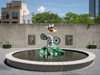 View of the PS1 Courtyard. Shown: Niki de Saint Phalle. La femme et L&#39;oiseau fontaine. 1967. Painted polyester resin. Courtesy Galerie Mitterrand, Paris; Galerie GP &amp; N Vallois, Paris; and Salon 94, New York; Raúl de Nieves. The Stories of the Past Rejoice through Children&#39;s Skies. 2021. Courtesy the artist and Company Gallery, New York. Photo: Kris Graves
