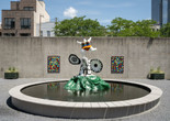 View of the PS1 Courtyard. Shown: Niki de Saint Phalle. La femme et L&#39;oiseau fontaine. 1967. Painted polyester resin. Courtesy Galerie Mitterrand, Paris; Galerie GP &amp; N Vallois, Paris; and Salon 94, New York; Raúl de Nieves. The Stories of the Past Rejoice through Children&#39;s Skies. 2021. Courtesy the artist and Company Gallery, New York. Photo: Kris Graves