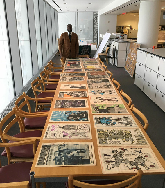 The author pictured with the collection of Patrick and Nesta McQuaid and Akili Tommasino in MoMA’s Department of Architecture and Design, October 11, 2019