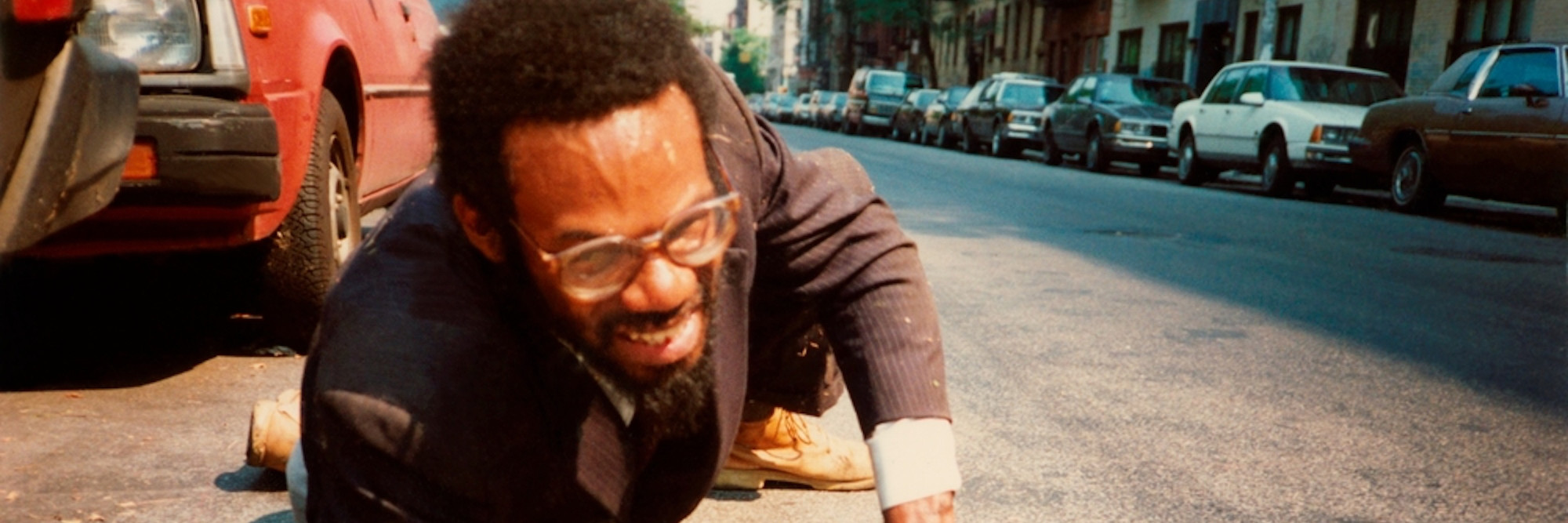 Pope.L. How Much is that Nigger in the Window a.k.a. Tompkins Square Crawl. 1991. Five inkjet prints; Timberland leather boots; asphalt. Acquired in part through the generosity of Jill and Peter Kraus, Anne and Joel S. Ehrenkranz, The Contemporary Arts Council of The Museum of Modern Art, The Jill and Peter Kraus Media and Performance Acquisition Fund, and Jill and Peter Kraus in honor of Michael Lynne. © 2019 Pope.L. Courtesy of the artist.