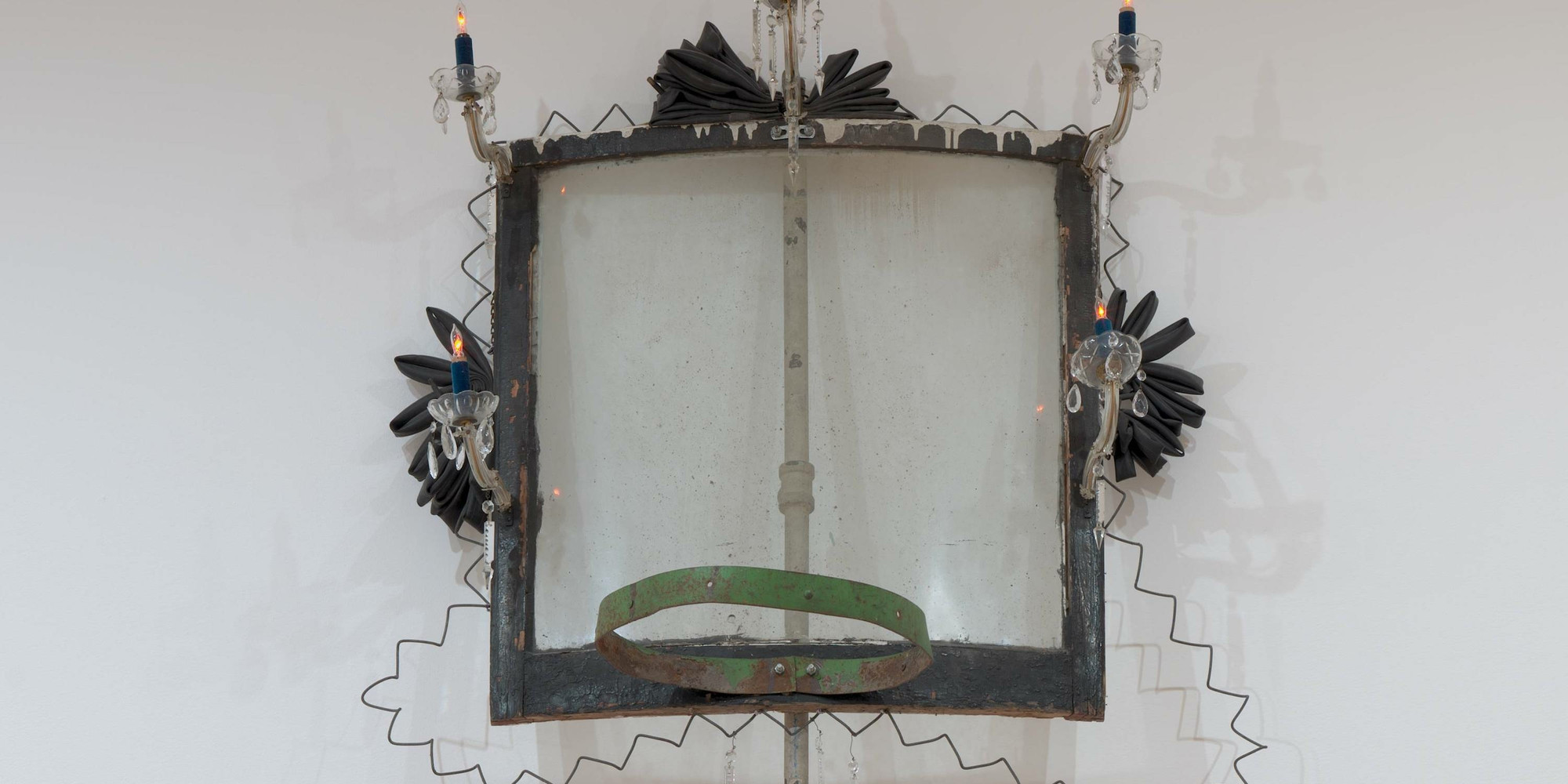 David Hammons. High Falutin’. 1990. Metal (some parts painted with oil), oil on wood, glass, dust, chandelier parts, rubber, velvet, plastic, and light bulbs, 13&#39; 2&#34; × 48&#34; × 30 1/2&#34; (396 × 122 × 77.5 cm). The Museum of Modern Art, New York. Robert and Meryl Meltzer Fund and purchase. © 2021 David Hammons