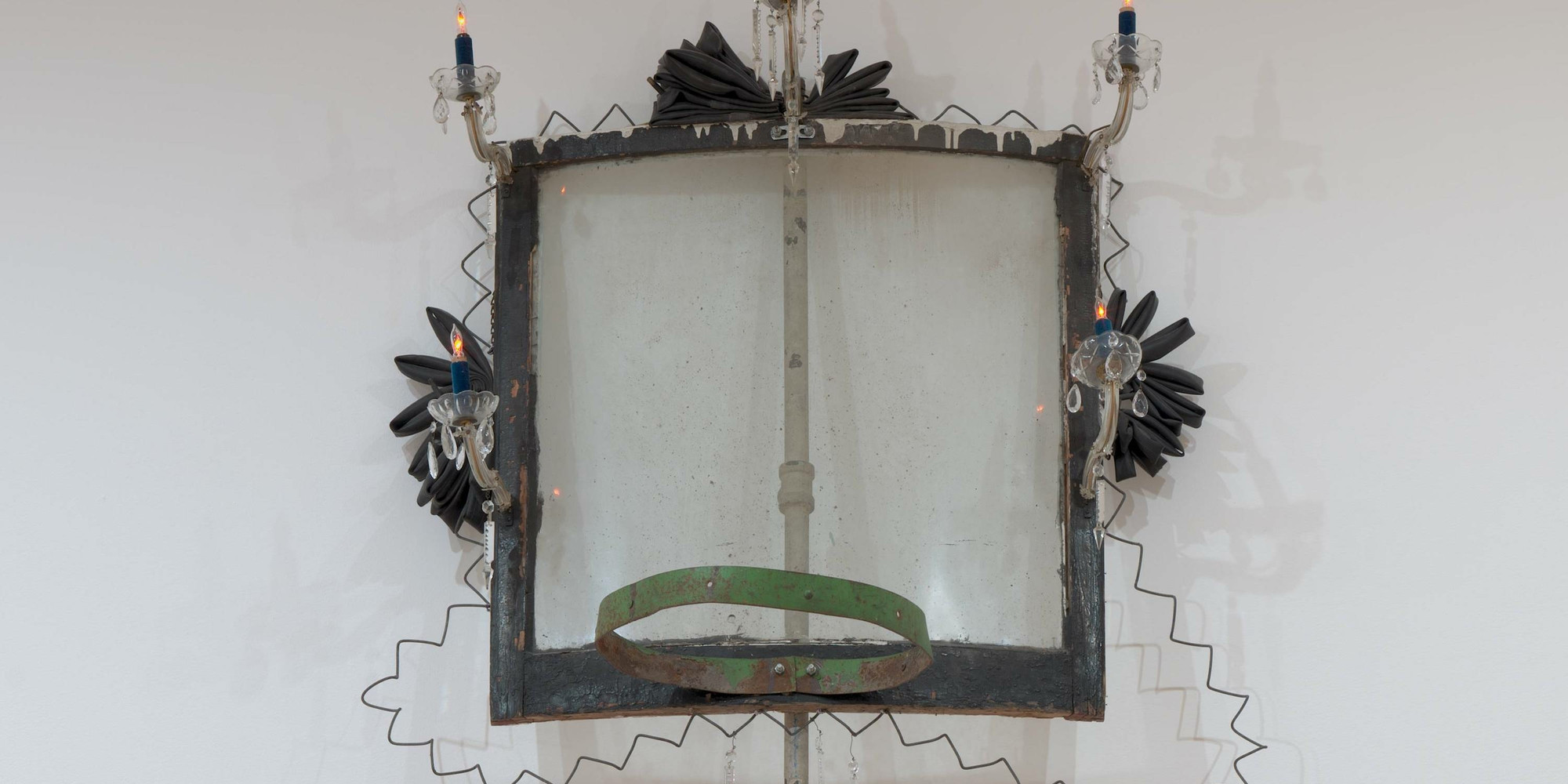 David Hammons. High Falutin’. 1990. Metal (some parts painted with oil), oil on wood, glass, dust, chandelier parts, rubber, velvet, plastic, and light bulbs, 13' 2" × 48" × 30 1/2" (396 × 122 × 77.5 cm). The Museum of Modern Art, New York. Robert and Meryl Meltzer Fund and purchase. © 2021 David Hammons