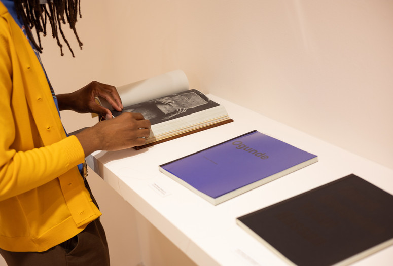 Visitor in the BlackMass Publishing "study hall," on view as part of Greater New York 2021. Photo: Marissa Alper