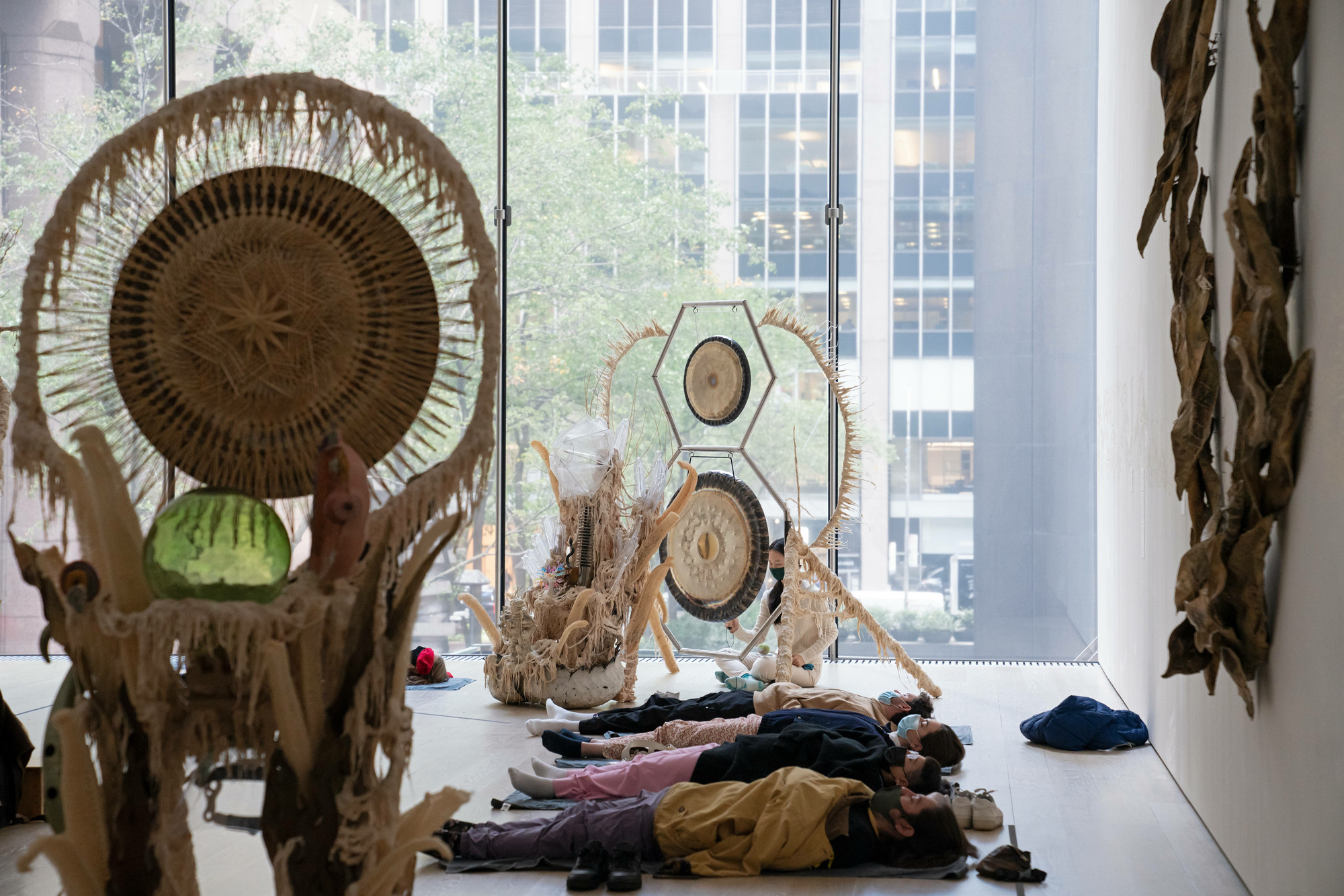 Guadalupe Maravilla: Luz y fuerza Healing Sound Baths, performed on November 3, 2021, as part of the gallery *Guadalupe Maravilla: Luz y Fuerza* in the exhibition *Collection 1970s–present*, October 30, 2021 - October 30, 2022. Performers: Guadalupe Maravilla, Hilary Ramos, and Sam Xu. Digital image © 2022 The Museum of Modern Art, New York. Photo: Julieta Cervantes