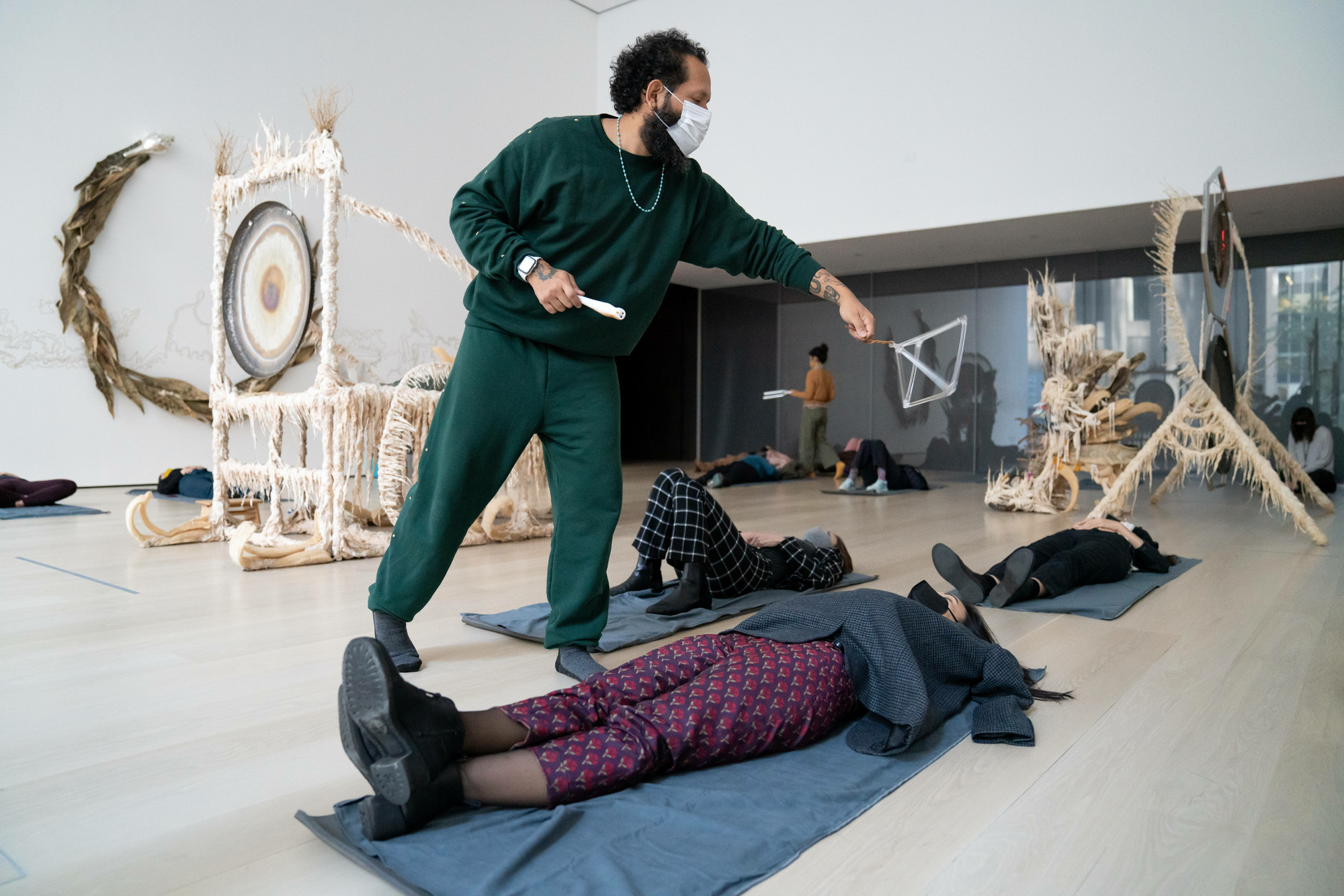 Guadalupe Maravilla: Luz y fuerza Healing Sound Baths, performed on November 3, 2021, as part of the gallery *Guadalupe Maravilla: Luz y Fuerza* in the exhibition *Collection 1970s–present*, October 30, 2021 - October 30, 2022. Performers: Guadalupe Maravilla, Hilary Ramos, and Sam Xu. Digital image © 2022 The Museum of Modern Art, New York. Photo: Julieta Cervantes