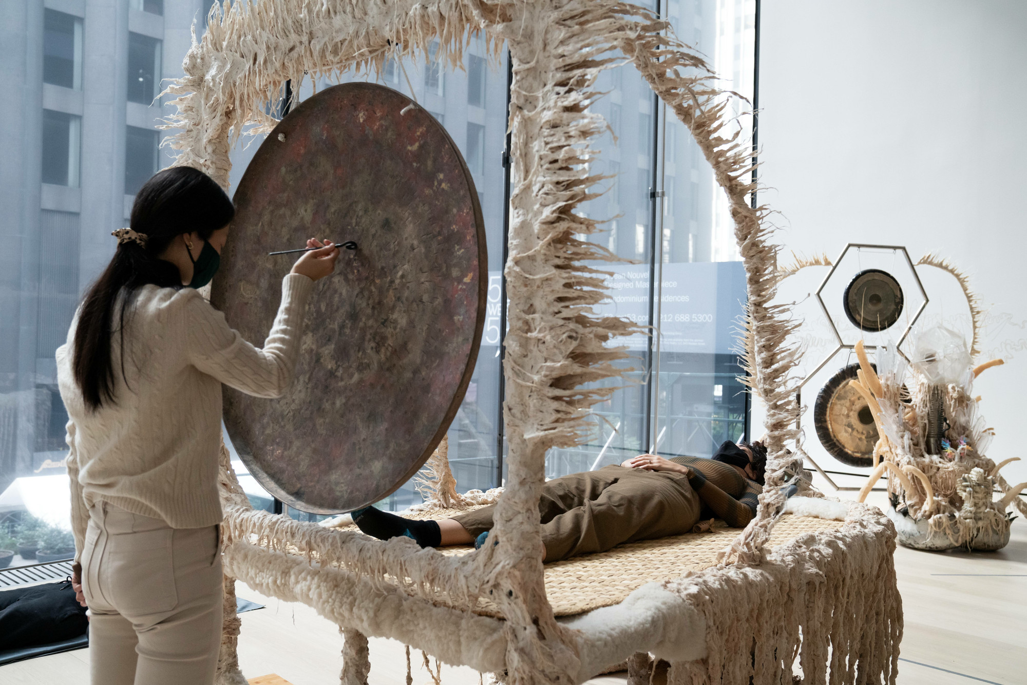 Guadalupe Maravilla: Luz y fuerza Healing Sound Baths, performed on November 3, 2021, as part of the gallery *Guadalupe Maravilla: Luz y Fuerza* in the exhibition *Collection 1970s–present*, October 30, 2021 - October 30, 2022. Performers: Guadalupe Maravilla, Hilary Ramos, and Sam Xu. Digital image © 2022 The Museum of Modern Art, New York. Photo: Julieta Cervantes