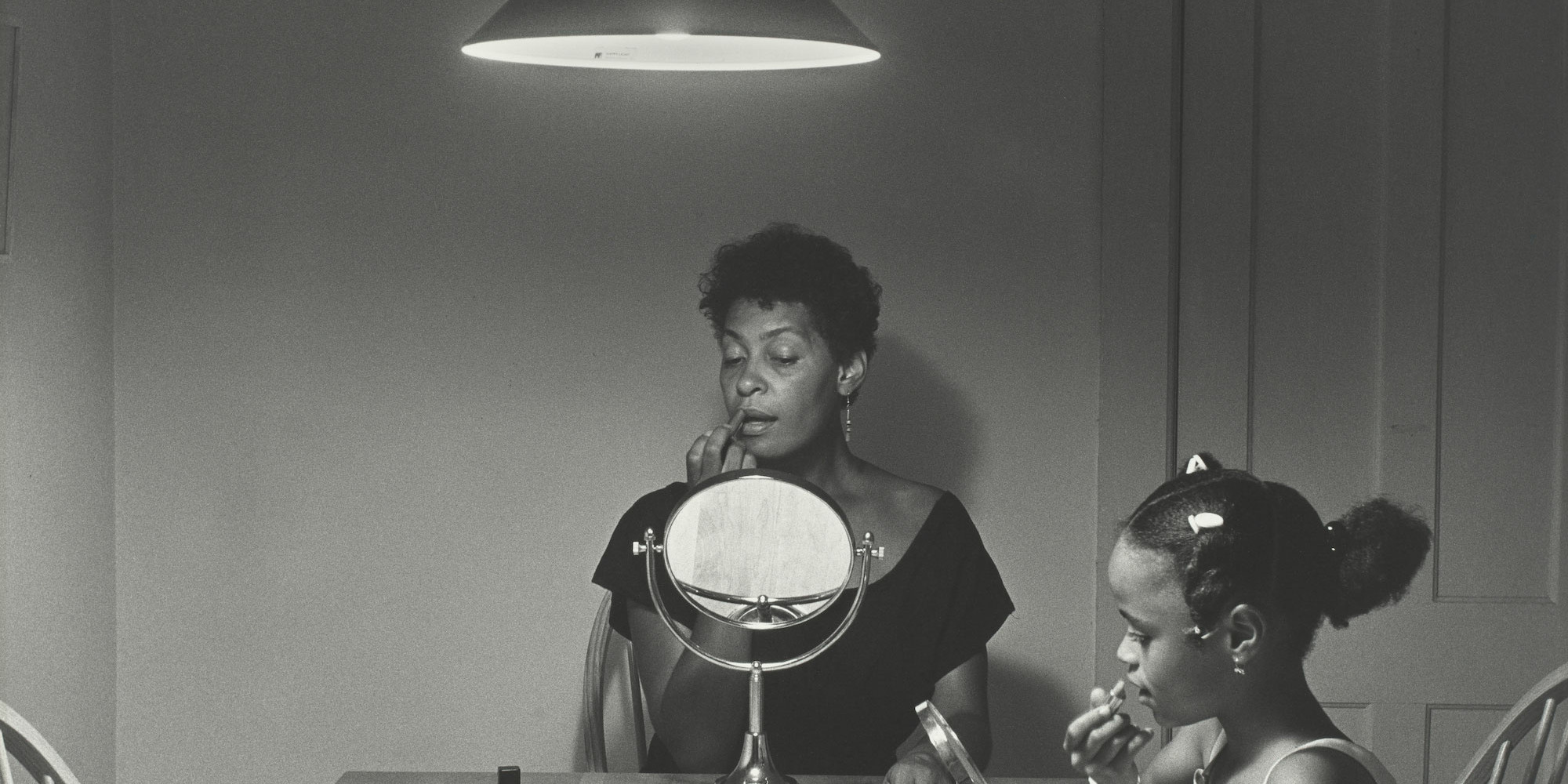 Carrie Mae Weems. Untitled (Woman and daughter with makeup). 1990. Gelatin silver print, 27 3/16 × 27 3/16"" (69.1 × 69.1 cm). The Museum of Modern Art, New York. Gift of Helen Kornblum in honor of Roxana Marcoci. © 2022 Carrie Mae Weems