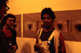 Gianfranco Gorgoni. Jean-Michel Basquiat at the opening of the Clocktower exhibition &#34;Gianfranco Gorgoni: Tight Shots”. September 13 - October 7, 1978. 35mm color slide, 1 15/16 × 1 15/16&#34; (5 × 5 cm). MoMA PS1 Archives, I.A.188. The Museum of Modern Art Archives, New York