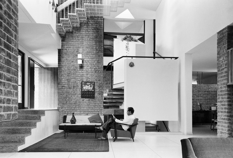 Achyut Kanvinde. Kanvinde Residence, New Delhi, India. 1965–67. Interior view, with the architect seated at center. c. 1966. Photograph: Madan Mahatta. Courtesy of the Kanvinde Rai & Chowdhury Archives, Madan Mahatta Archives, and PHOTOINK