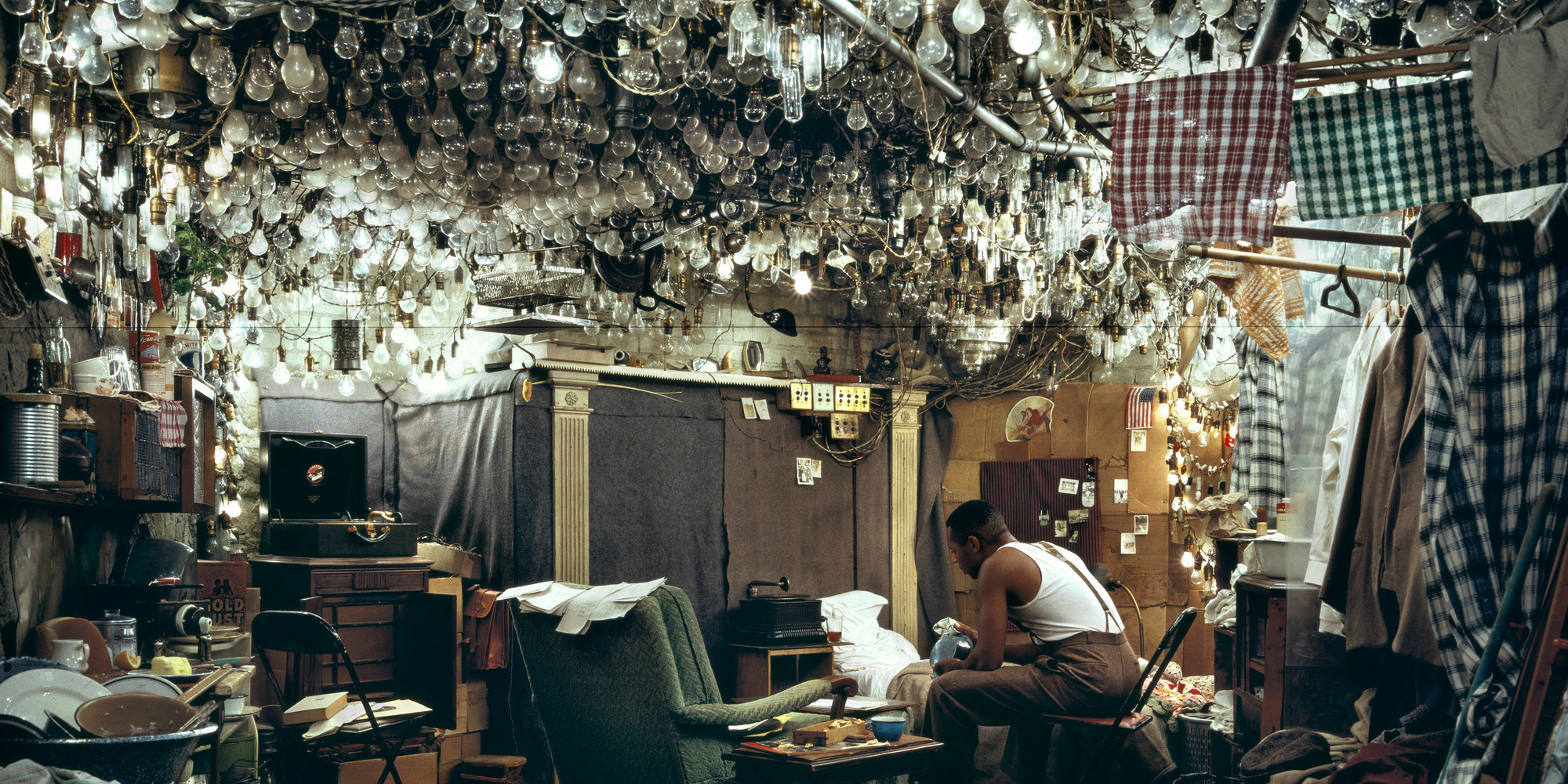Jeff Wall. After “Invisible Man” by Ralph Ellison, the Prologue. 1999–2000. Silver dye bleach transparency; aluminum light box: 5 ft. 8 1/2 in. × 8 ft. 2 3/4 in. (174 × 250.8 cm). The Museum of Modern Art, New York. The Photography Council Fund, Horace W. Goldsmith Fund through Robert B. Menschel, and acquired through the generosity of Jo Carole and Ronald S. Lauder and Carol and David Appel. © 2022 Jeff Wall