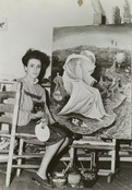 Leonora Carrington. Photograph of Leonora Carrington with her painting &#34;The Temptation of Saint Anthony&#34;. 1945. Gelatin Silver Print, 8 3/16 x 10&#34; (20.8 x 25.4 cm). Photographic Archive, Artists and Personalities. The Museum of Modern Art Archives, New York