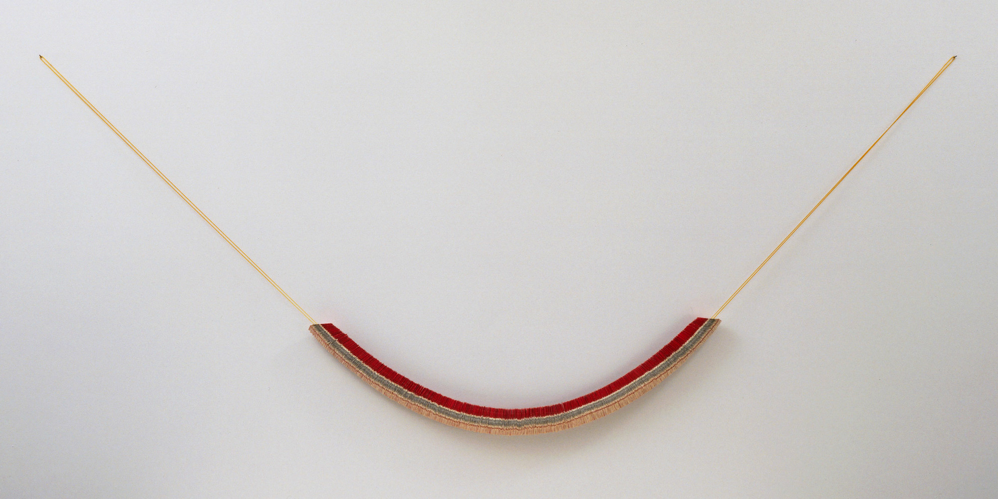 Jac Leirner. Lung (Pulmão). 1987. Marlboro cigarette packages strung on a polyurethane cord, dimensions variable, 14' 5 1/4" (440 cm) to 15' 9" (480 cm) wide. David Rockefeller Fund for Latin-American Art and Brazil Fund. © 2022 Jac Leirner