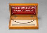 Cildo Meireles. To Be Curved with the Eyes. 1970/78. Wood box, iron bars, enamel plaque, glass and graph paper. Gift of Patricia Phelps de Cisneros through the Latin American and Caribbean Fund in honor of Andrea and José Olympio Pereira