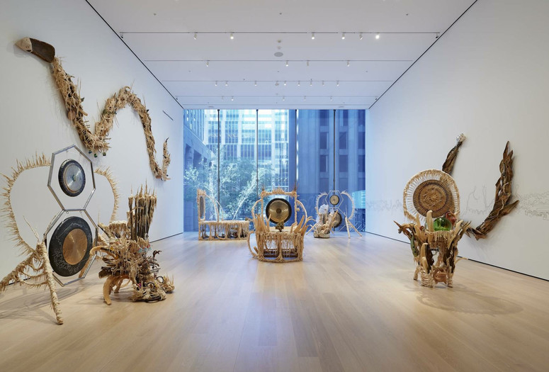Installation view of the gallery &#34;Guadalupe Maravilla: Luz y Fuerza&#34; in the exhibition &#34;Collection 1970s–Present,” October 30, 2021 - October 30, 2022. The Museum of Modern Art, New York. Digital Image ©️ 2022 The Museum of Modern Art, New York. Photo: David Almeida Image description: A photograph of seven sculptures made out of natural materials by the artist Guadalupe Maravilla, installed on the floor and the walls of a MoMA gallery.