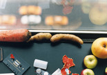 Wolfgang Tillmans. still life, New York . 2001. Image courtesy of the artist, David Zwirner, New York/Hong Kong, Galerie Buchholz, Berlin/Cologne, Maureen Paley, London Image description: A horizontally oriented photograph shows a close-up view of a windowsill. A carrot, fingerling potatoes, apples, vegetable peels, a cassette tape, and an empty film canister are scattered near the windowpane, with a blurry view of a city street below.
