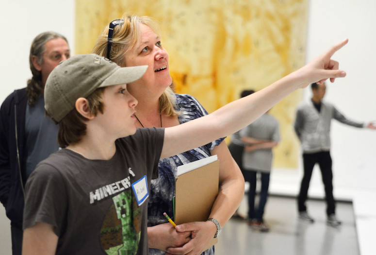 Family Gallery Talk. 2014. Digital Image © The Museum of Modern Art, New York. New York Photo: Manuel Martagon Image description: A tween pointing out something in a painting during a Family Gallery Talk.