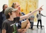 Family Gallery Talk. 2014. Digital Image © The Museum of Modern Art, New York. New York Photo: Manuel Martagon Image description: A tween pointing out something in a painting during a Family Gallery Talk.