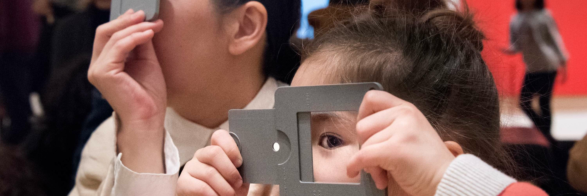 Family Gallery Talks. 2017. Digital Image © The Museum of Modern Art, New York. New York Photo: Martin Seck Image description: A parent and child looking at art through viewfinders during a Family Gallery Talk. Photo: Martin Seck
