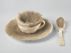 Meret Oppenheim. Object (Objet). 1936. Fur-covered cup, saucer, and spoon. Cup 4 3/8″ (10.9 cm) in diameter; saucer 9 3/8″ (23.7 cm) in diameter; spoon 8″ (20.2 cm) long, overall height 2 7/8″ (7.3 cm).The Museum of Modern Art, New York. Purchase