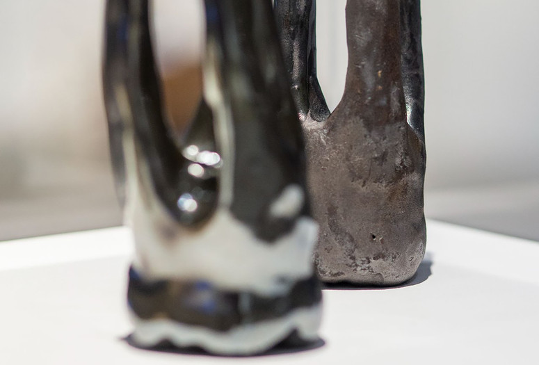 Untitled. 2022. Clay. Courtesy of BLACK BEYOND Image Description: Ceramic sculptures resembling teeth crafted by artist Anastasia Warren sit on a white surface.