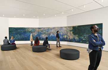 A view of the fifth-floor collection galleries. Shown: Claude Monet. Water Lilies. 1914–26. Oil on canvas, three panels. Mrs. Simon Guggenheim Fund. © 2022 The Museum of Modern Art, New York. Photo: Noah Kalina