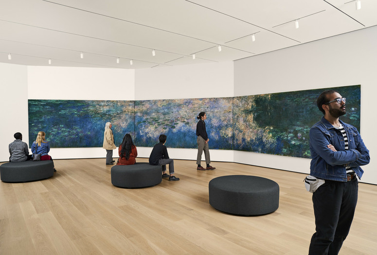 A view of the fifth-floor collection galleries. Shown: Claude Monet. Water Lilies. 1914–26. Oil on canvas, three panels. Mrs. Simon Guggenheim Fund. © 2023 The Museum of Modern Art, New York. Photo: Noah Kalina