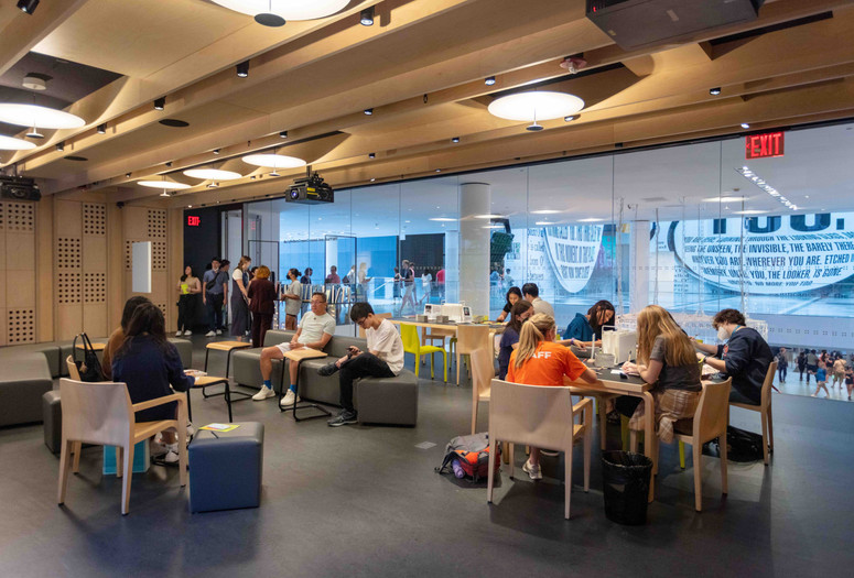 Photo of people sitting at tables in the Creativity Lab. The Museum of Modern Art, New York. Photo: Beatriz Meseguer/onwhitewalls.com. Digital image ©️ 2022 The Museum of Modern Art, New York