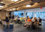 Photo of people sitting at tables in the Creativity Lab. The Museum of Modern Art, New York. Photo: Beatriz Meseguer/onwhitewalls.com. Digital image ©️ 2022 The Museum of Modern Art, New York