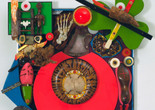 Alfonso Ossorio. Empty Chair or The Last Colonial (detail). 1969. Glass and plastic marbles, West African wood figures, tree fragments, pebbles, geode, iron nails, coral, seashells, wood shoe trees, lobster claws, sword, painted human foot bones and vertebra, faux pearls, plastic and wooden letters, plastic sheets and scraps, wood scraps, painted wood, animal claws and bones, domino, glass eyes, bell, and other materials on plastic sheets mounted on wood, 46 3/8 × 39 1/4 × 15 7/8&#34; (117.7 × 99.7 × 40.3 cm). Gift of the artist
