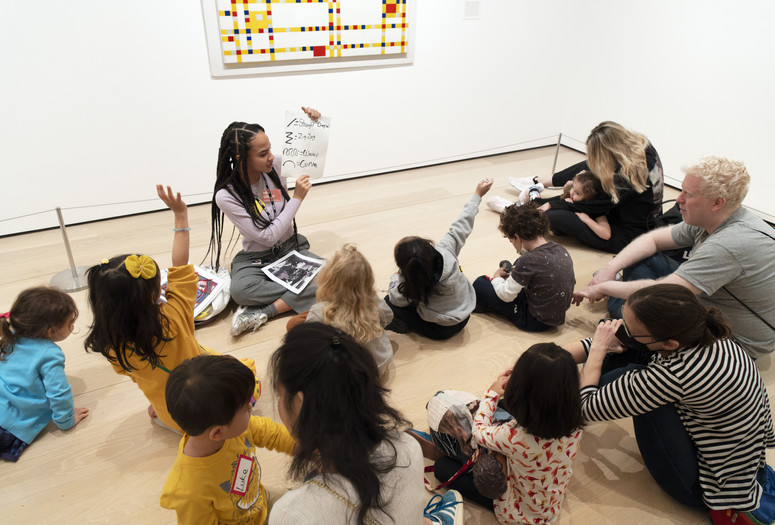 Participants discussing how lines make up places in a Family Gallery Talk. Photo: Martin Seck