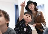 Parent and child looking at and drawing art during a Family Gallery Talk. Photo: Martin Seck