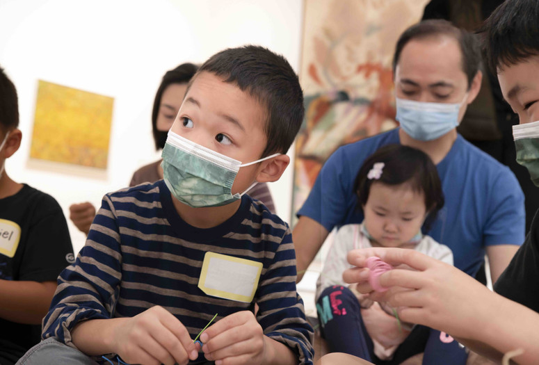 A family engaged in an activity during a Family Gallery Talk. Photo: Martin Seck