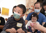 A family engaged in an activity during a Family Gallery Talk. Photo: Martin Seck