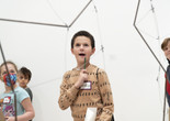 Child looking at a sculpture during a Family Gallery Talk. Photo: Martin Seck