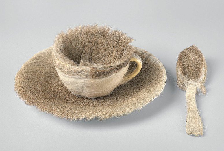 Meret Oppenheim. Object (Objet). 1936. Fur-covered cup, saucer, and spoon; cup 4 3/8″ (10.9 cm) in diameter; saucer 9 3/8″ (23.7 cm) in diameter; spoon 8″ (20.2 cm) long, overall height 2 7/8″ (7.3 cm). The Museum of Modern Art, New York. Purchase