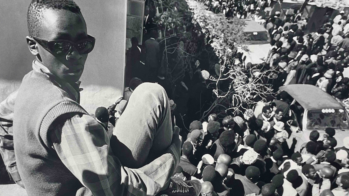 Jeanne Moutoussamy-Ashe. Robert Sobukwe’s Funeral: His Coffin Descends but His Spirit Remains, Graaff-Reinet, South Africa. 1978. Gelatin silver print, 11 3/16 × 16 9/16&#34; (28.4 × 42.1 cm). Agnes Rindge Claflin Fund