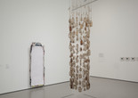 Installation view of Nari Ward&#39;s Vertical Hold. 1996. Yarn and bottles, 107 × 30&#34; (271.8 × 76.2 cm). The Museum of Modern Art, New York. Gift of the Hudgins Family in memory of J. I. Nelson and Sarita Nelson-Nunnelee
