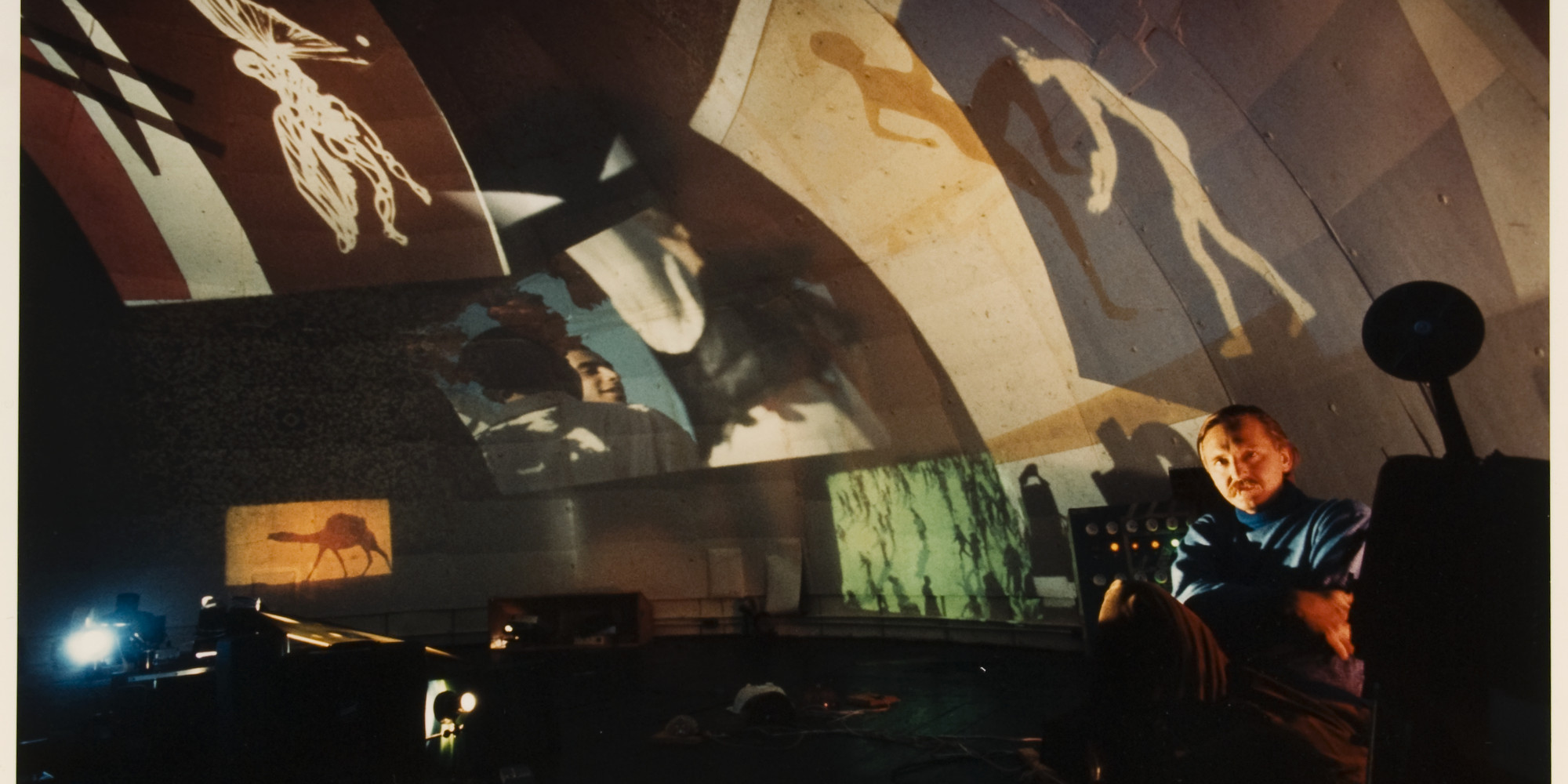 Interior of Movie-Drome, Stony Point, New York, 1964, with VanDerBeek at right. © 2023 Northwestern University. Photo: Peter Moore, Peter Moore Photography Archive, Charles Deering McCormick Library of Special Collections, Northwestern University Libraries