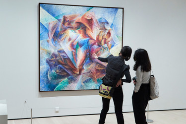 Two visitors observing Umberto Boccioni&#39;s Dynamism of a Soccer Player. Photo: Gus Powell.