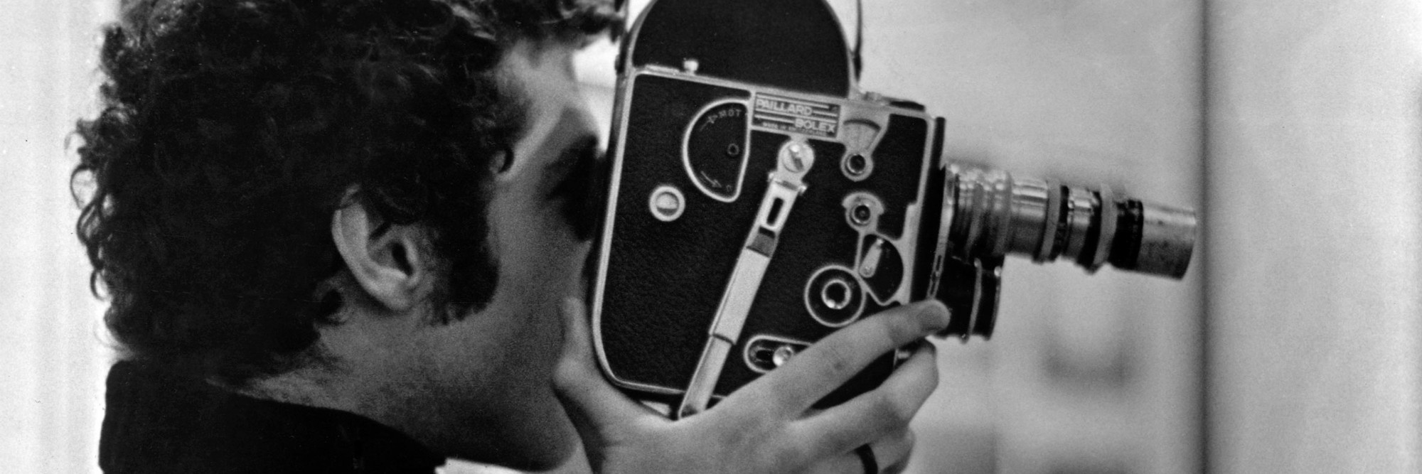 Warren Sonbert with his Bolex. Courtesy Jon Gartenberg