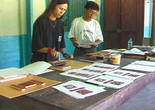 Still from the video Yanomami Owë Mamotima of Laura Anderson Barbata and Sheroanawe Hakihiiwe working on an edition of the book Shapono, Mahekototeri, Venezuela, 2001