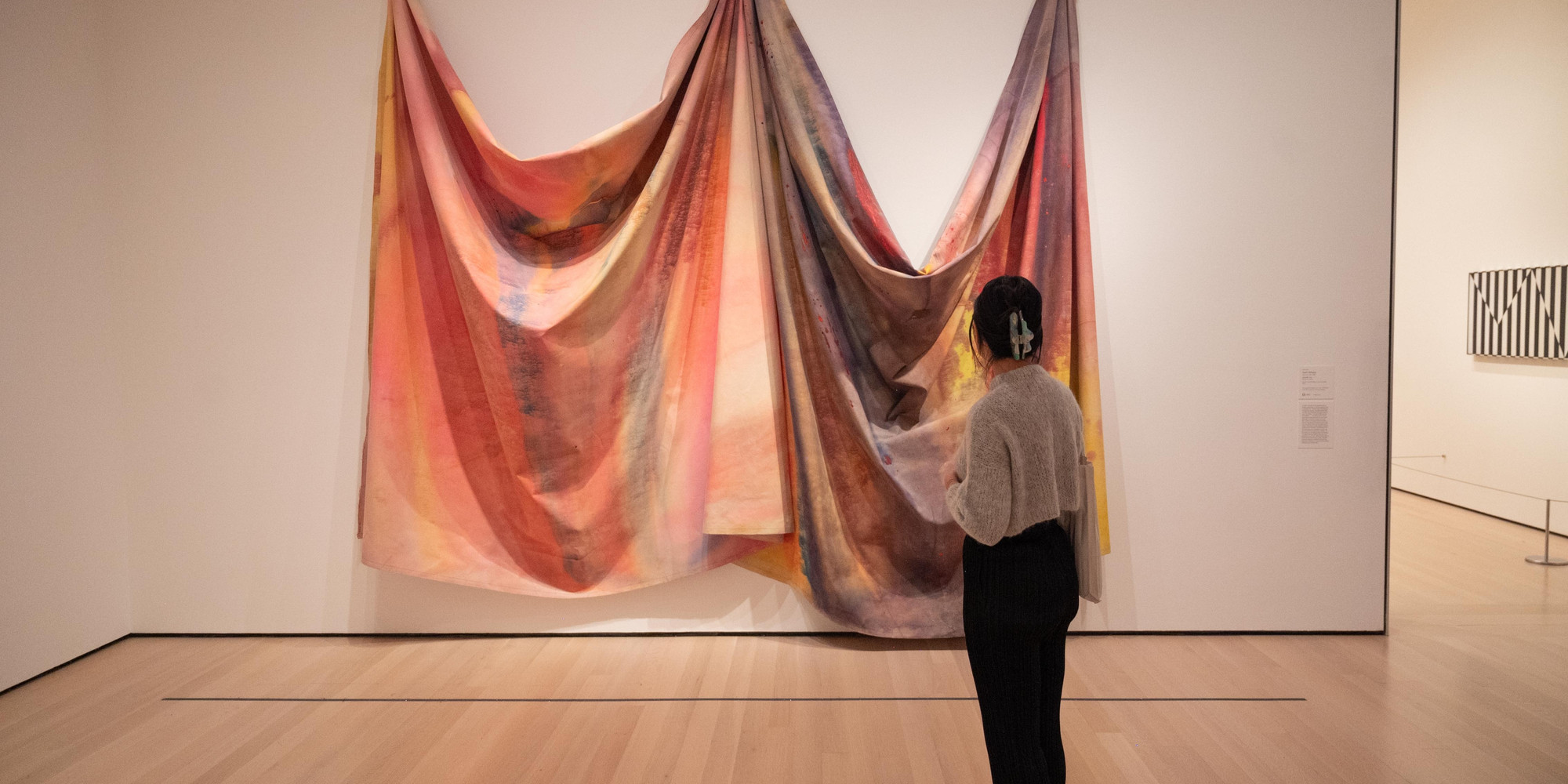 Larissa Pham at the Museum of Modern Art. Photo: Naeem Douglas. © 2023 Naeem Douglas. Shown: Sam Gilliam. 10/27/69. 1969. Acrylic on canvas, 140 × 185 × 16&#34; (355.6 × 469.9 × 40.6 cm). The Museum of Modern Art, New York. Sam A. Lewisohn Bequest (by exchange)