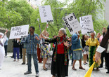 The Museum of Modern Art, New York. Photo: Manuel Molina Martagon Image description: A photograph of a group of older adults gathered outside in MoMA’s Sculpture Garden with a marching band. The crowd wears colorful clothing and hold signs that say “Aging and Raging!” and “Grow Up! Everyone Grows Old!”