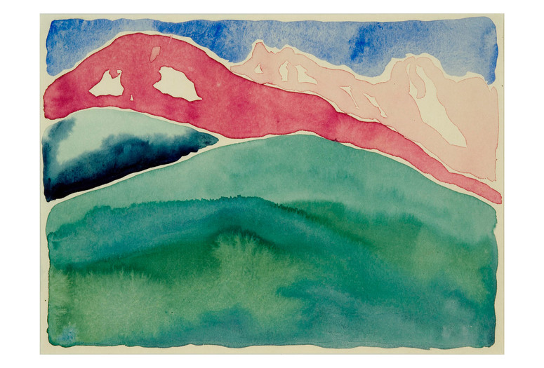 Georgia O’Keeffe. Pink and Green Mountains No. I. 1917. Watercolor on paper. Spencer Museum of Art, The University of Kansas, Lawrence. Museum purchase, Letha Churchill Walker Art Fund. ©️ 2023 Georgia O’Keeffe Museum/Artists Rights Society (ARS), New York Image Description: A watercolor landscape painting of rolling mountains against a blue sky. Loose watery brushstrokes shape each mountain painted on cream colored paper. A grassy green ridge fills half of the page in the foreground, with deep blue, red, and pale pink peaks building on top of each other as they go further back into the distance.